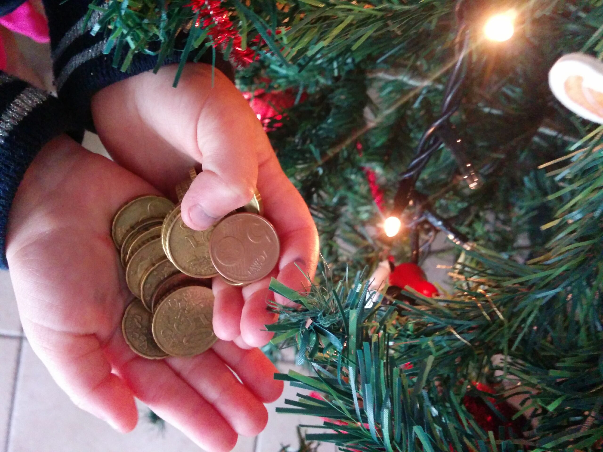 New Year Traditions in Greece | Family Experiences Blog | Kids receiving coins