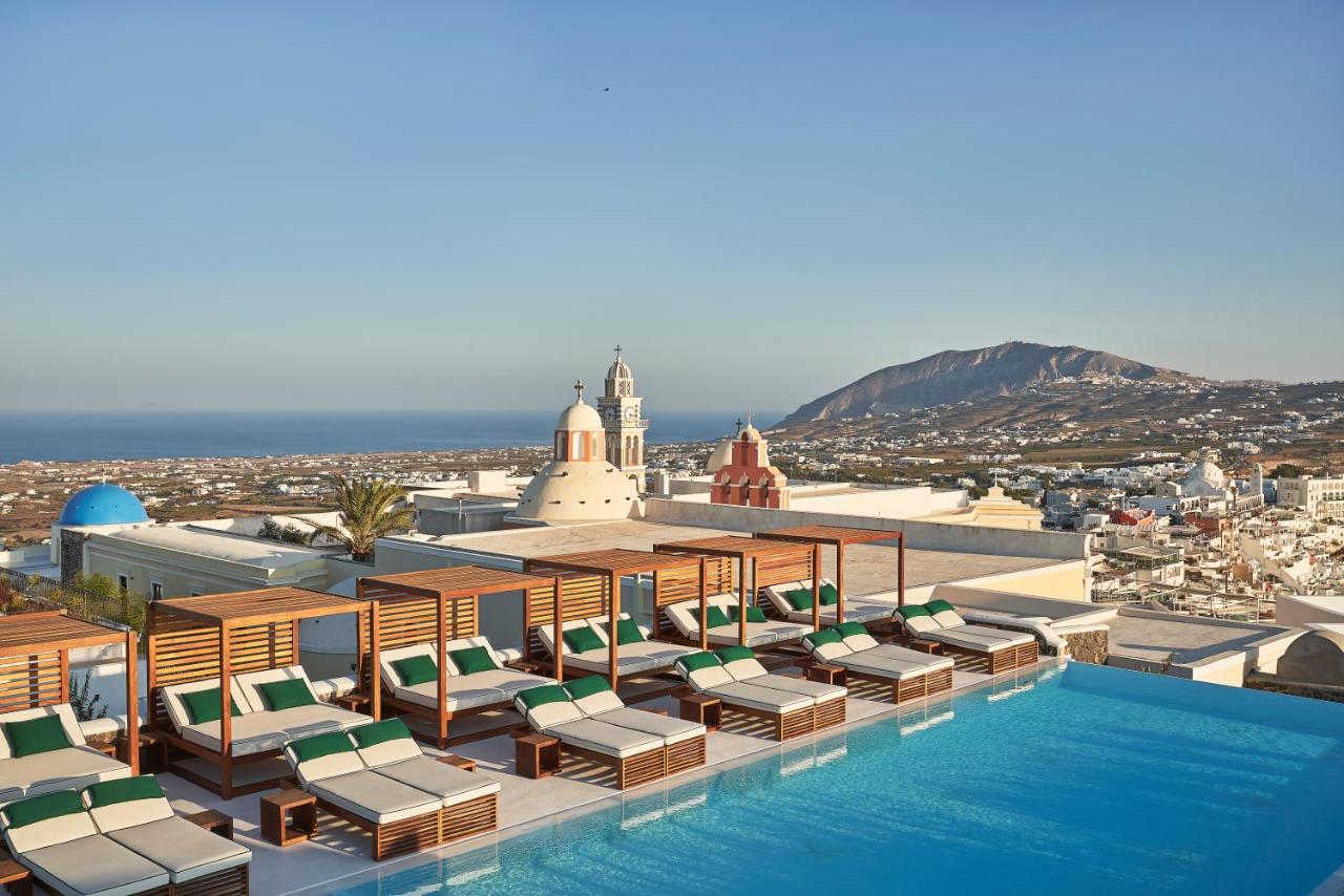 The Best Family Hotels in Santorini: Top Picks for Kids, Comfort & Views 11 Katikies Garden Santorini pooll view and church