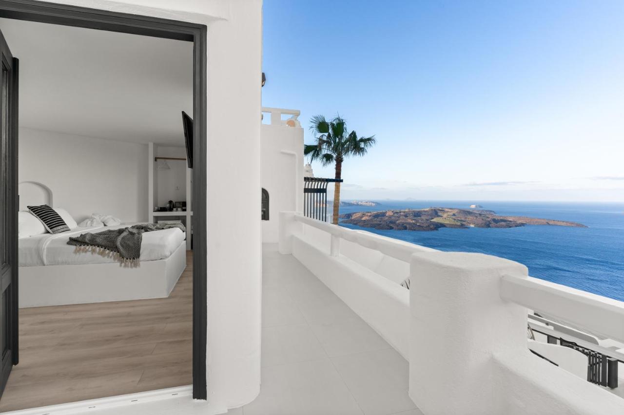 The Best Family Hotels in Santorini: Top Picks for Kids, Comfort & Views 27 Mill House elegant Suites bedroom and balcony view over the sea