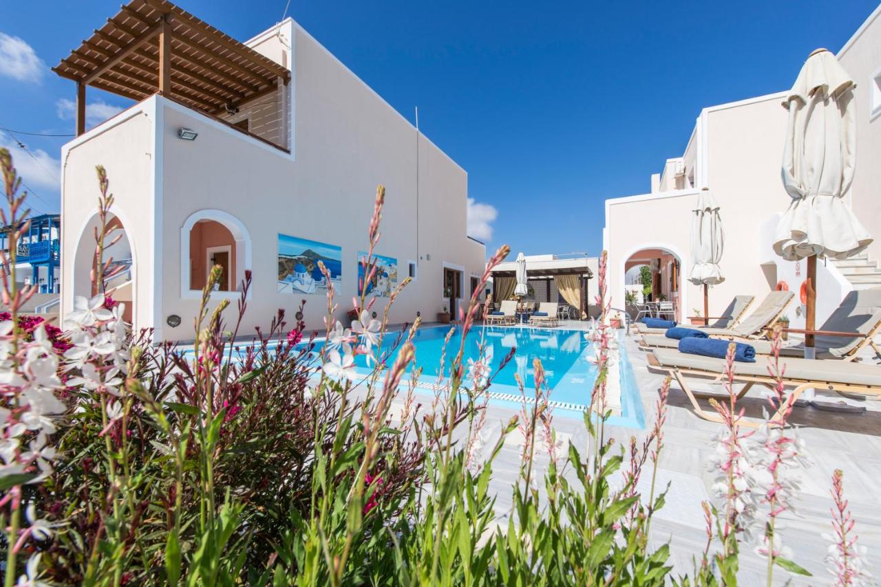 The Best Family Hotels in Santorini: Top Picks for Kids, Comfort & Views 21 Family friendly Villa Voula in Santorini pool with seat and flowers