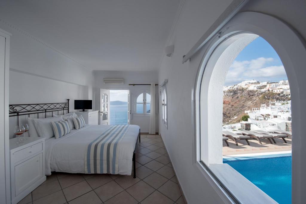 The Best Family Hotels in Santorini: Top Picks for Kids, Comfort & Views 26 Agnadema apartments view from bedroom over pool and Santorini