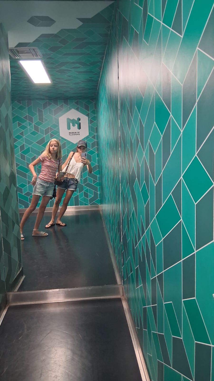 My teens in the museum of Illusions in Athens Greece in summer 2025