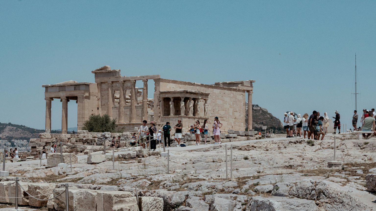 People visiting the Acropolis archaeological site in Greece